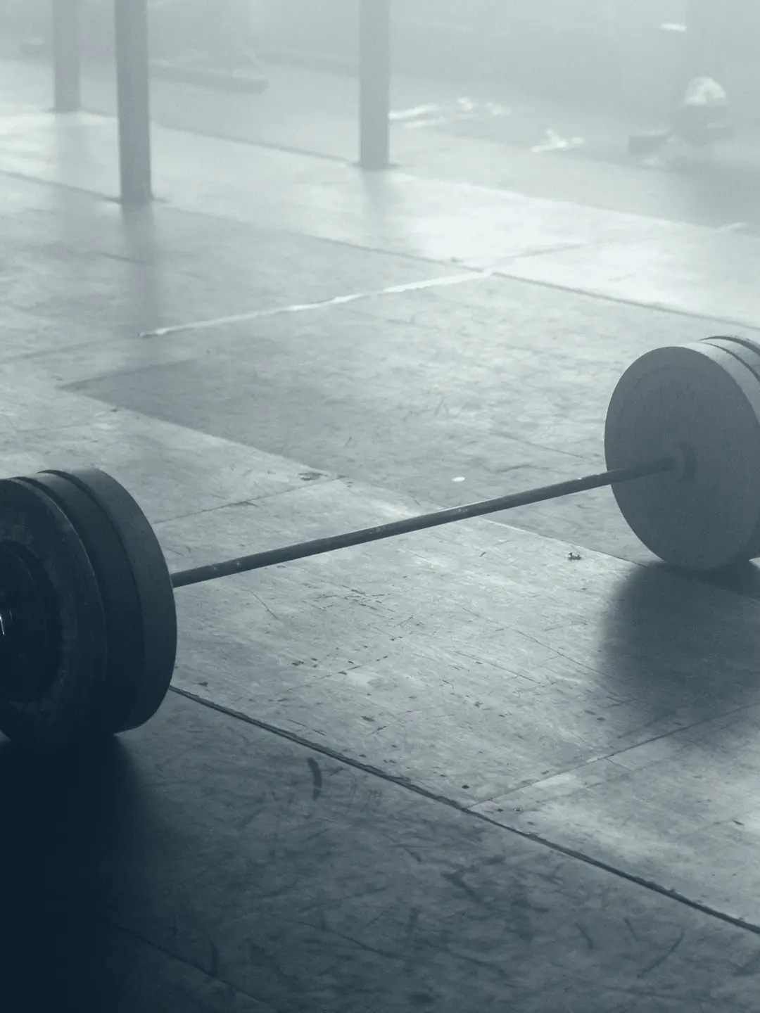 Loaded barbell on a gym floor